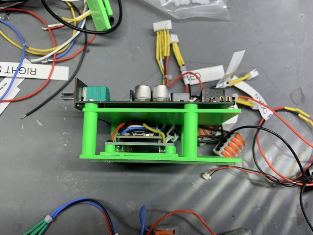 CAD view of an enclosure with mounting holes and ventilation panels