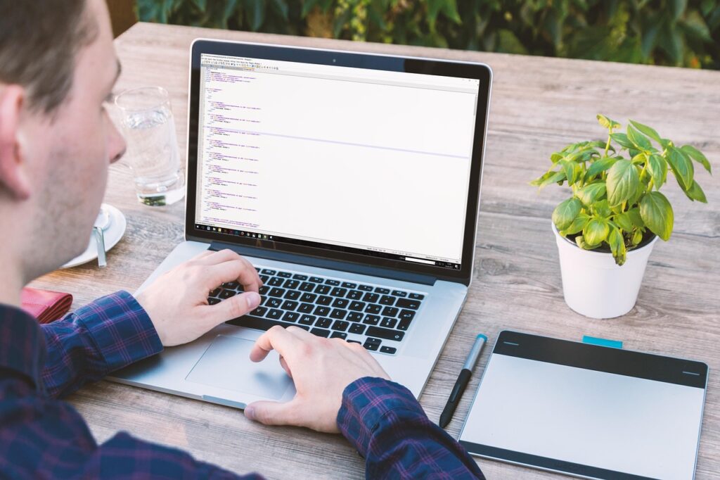 Designer crafting a print‑ready STL file on a laptop for FDM Ready STL Files for Rapid Prototyping